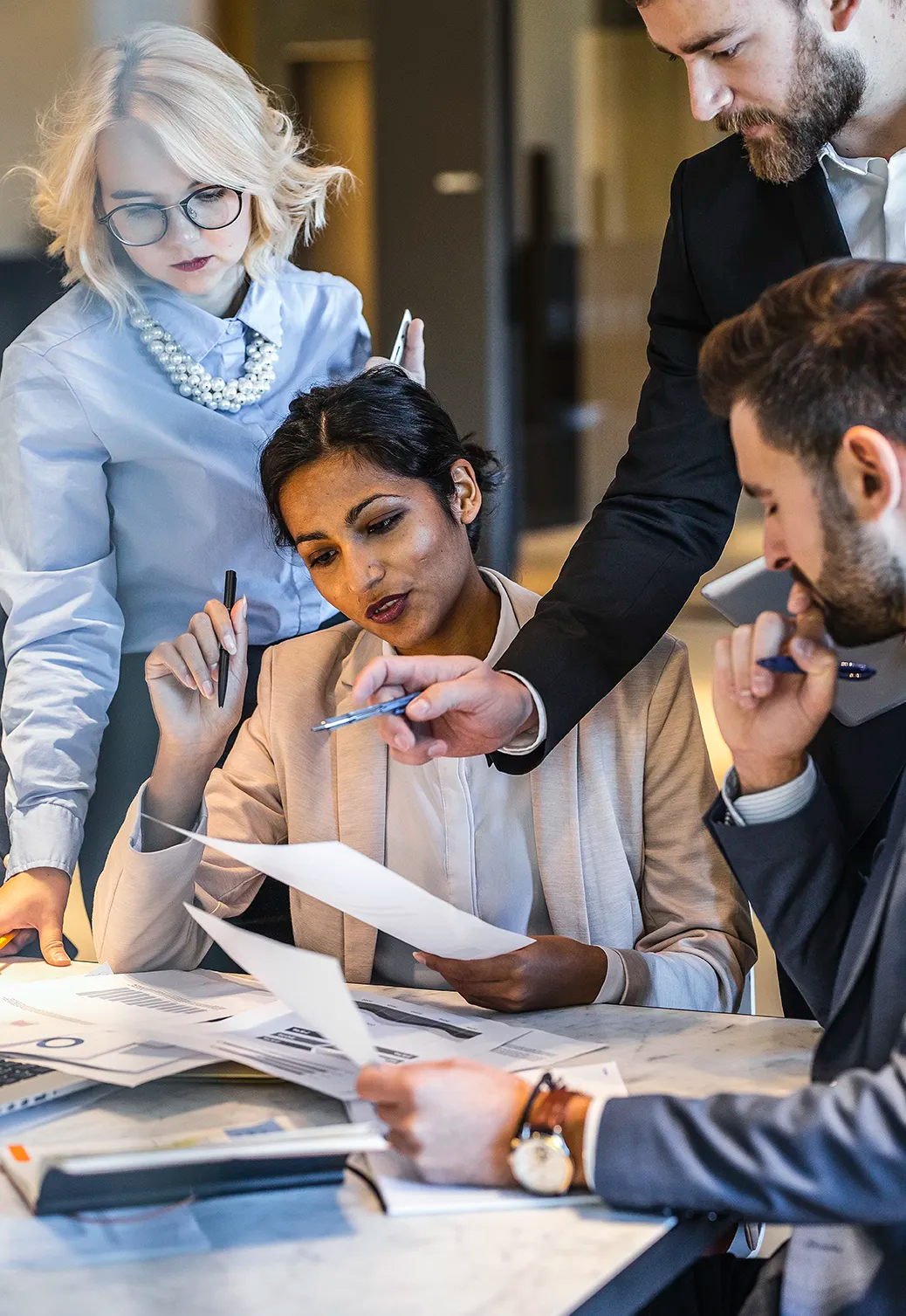 A group of finance professionals in a training session